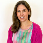 an image of a lady in black hair with a red sweater